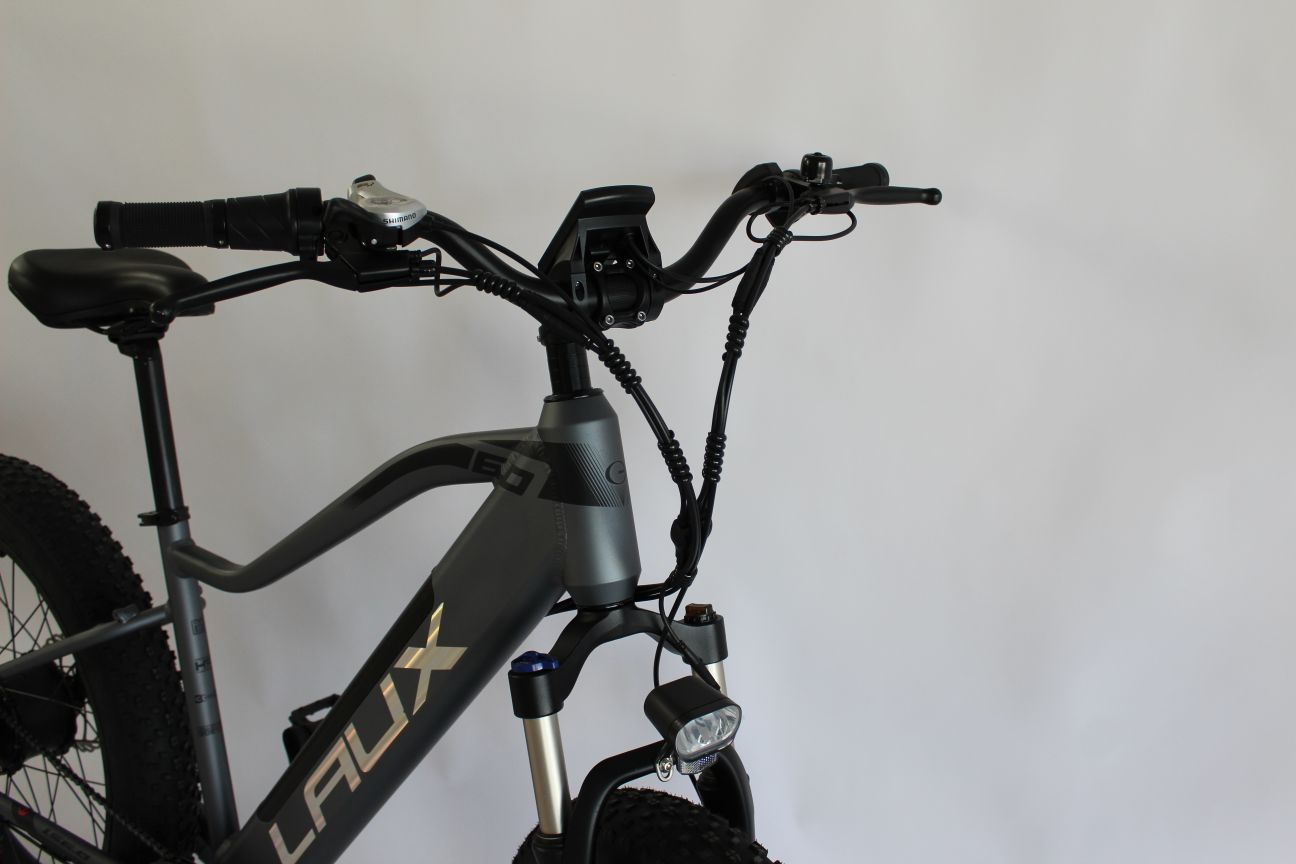 handlebar and shifter and front light and fork suspension lockout